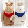 EN71 best Christmas gift China low price cute rabbit brothers fuzzy bunny plush toy animal with mini hot water bag inside