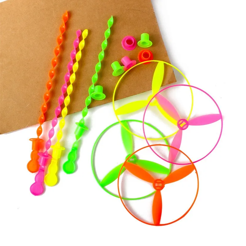 China Cheap Plastic Hand Push Rotating Flying Saucer Toy Flying Disc