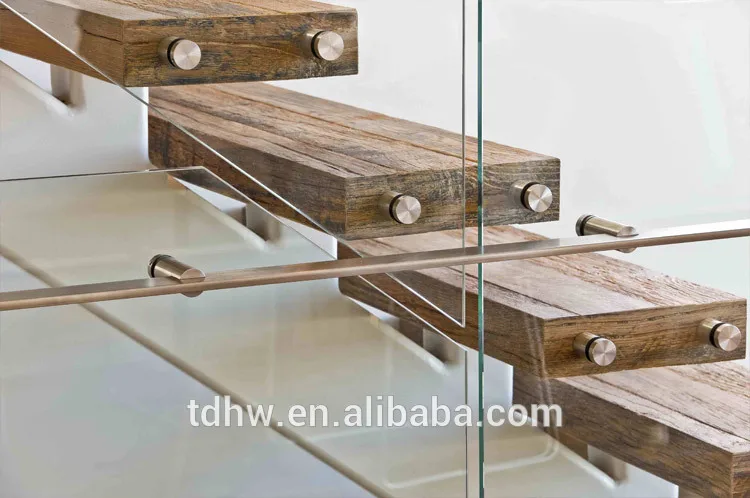 
Single spine stringer stairs with 12mm frameless glazed balustrades and Flat bar handrails 