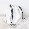 dustbag with black drawstring bag
