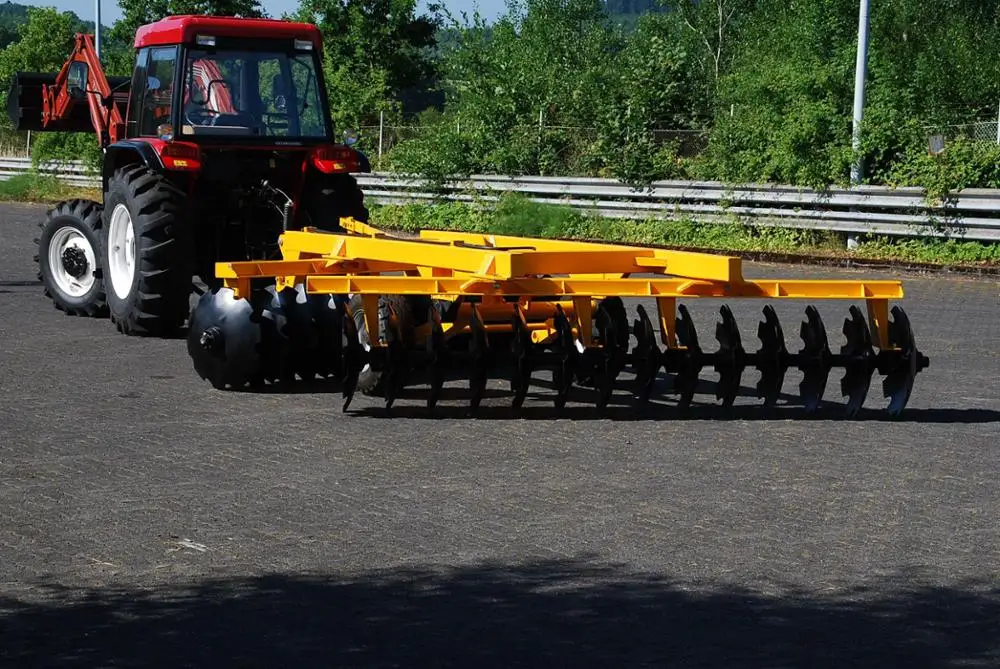 Tractor with harrow