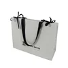 /product-detail/spot-uv-custom-white-color-matt-clothes-print-paper-shopping-gift-bag-62043525704.html