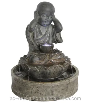 resin meditating buddha on column patio fountain with led light