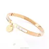 Yiwu Aceon Stainless Steel Gold Shell Inlay Disc Charm Hinge Bangle