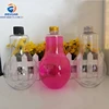 /product-detail/unique-shape-plastic-light-bulb-bottle-with-screw-lid-for-beverage-60705662256.html