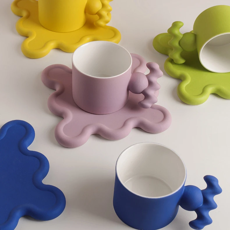 

Newly designed ceramic coffee cup and ceramic coaster with creative handle, As the picture show