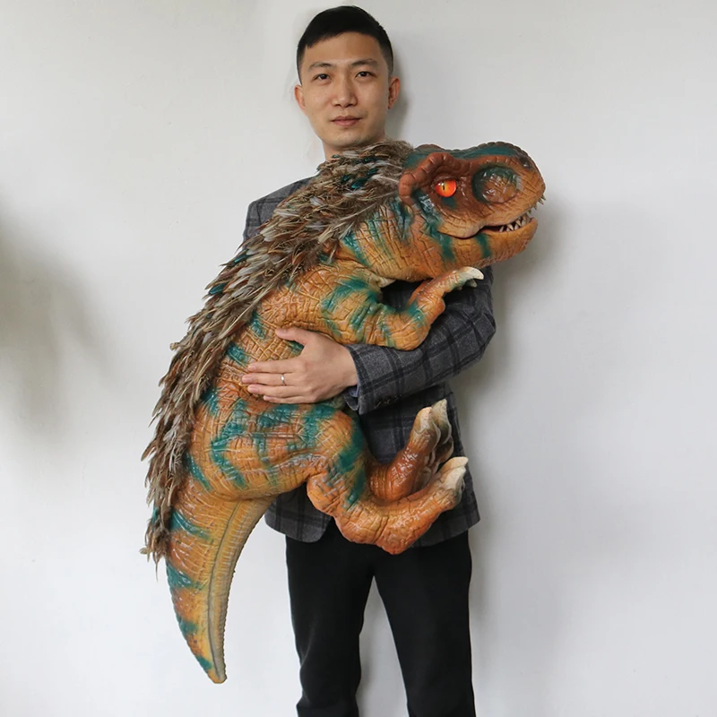 

Animatronic baby dinosaur hand puppet with feather