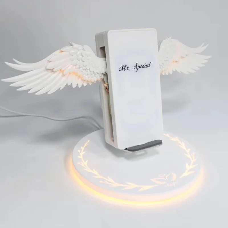 беспроводная зарядка с крыльями. супер крылья карусель. беспроводная зарядка angel wings. супер крылья подзарядка. беспроводная зарядка с крыльями ангела.