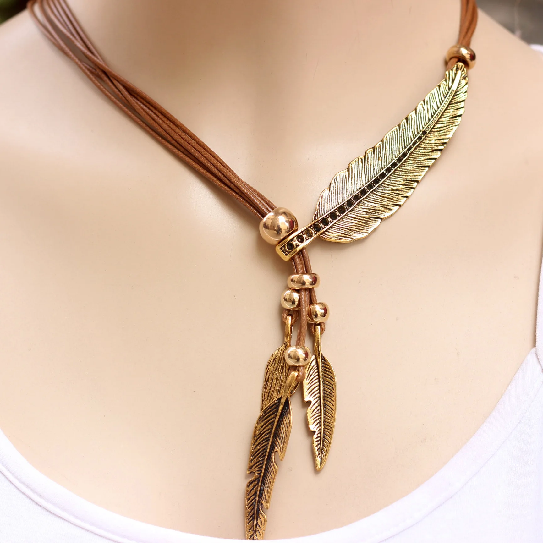 

Brown Ropes And Golden Feathers Black Rope And Silver Rope Big Feathers Three Little Feathers Ladies Sweater Chain Necklace