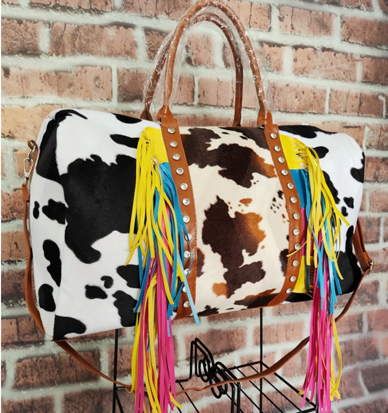 

2021 Amazon Hot Women Cow Print Travel Rivet Duffle Purse Vintage Custom Weekender Bags with Colorful Tassel