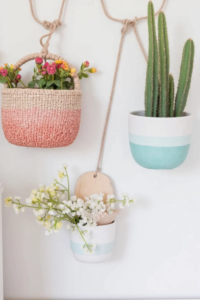 A painted and personalized wall-hanging basket in a child's room