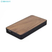 

Factory sell bamboo wood portable travel mobile power bank 6000mah 5V 2.1A output fast rechargeable treasure oem odm