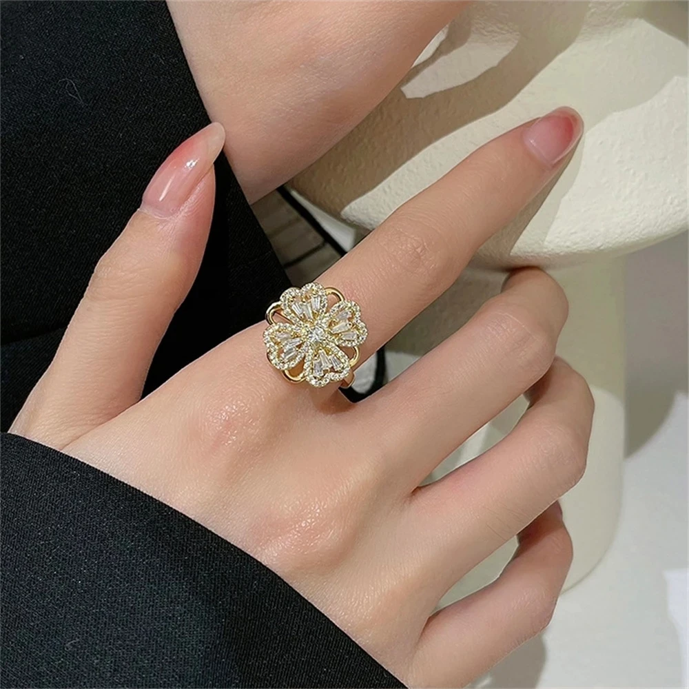 

Temperament micro-inlaid zircon rotating four-leaf clover ring opening adjustable fashion light luxury ring female
