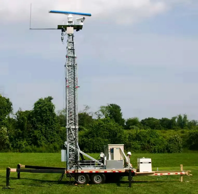 Mobile trailer lifting tower deployed outdoors with elevated equipment