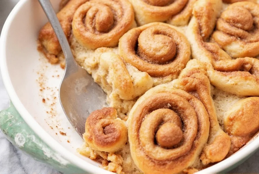 Professional baker spreading cinnamon sugar filling evenly on rolled dough
