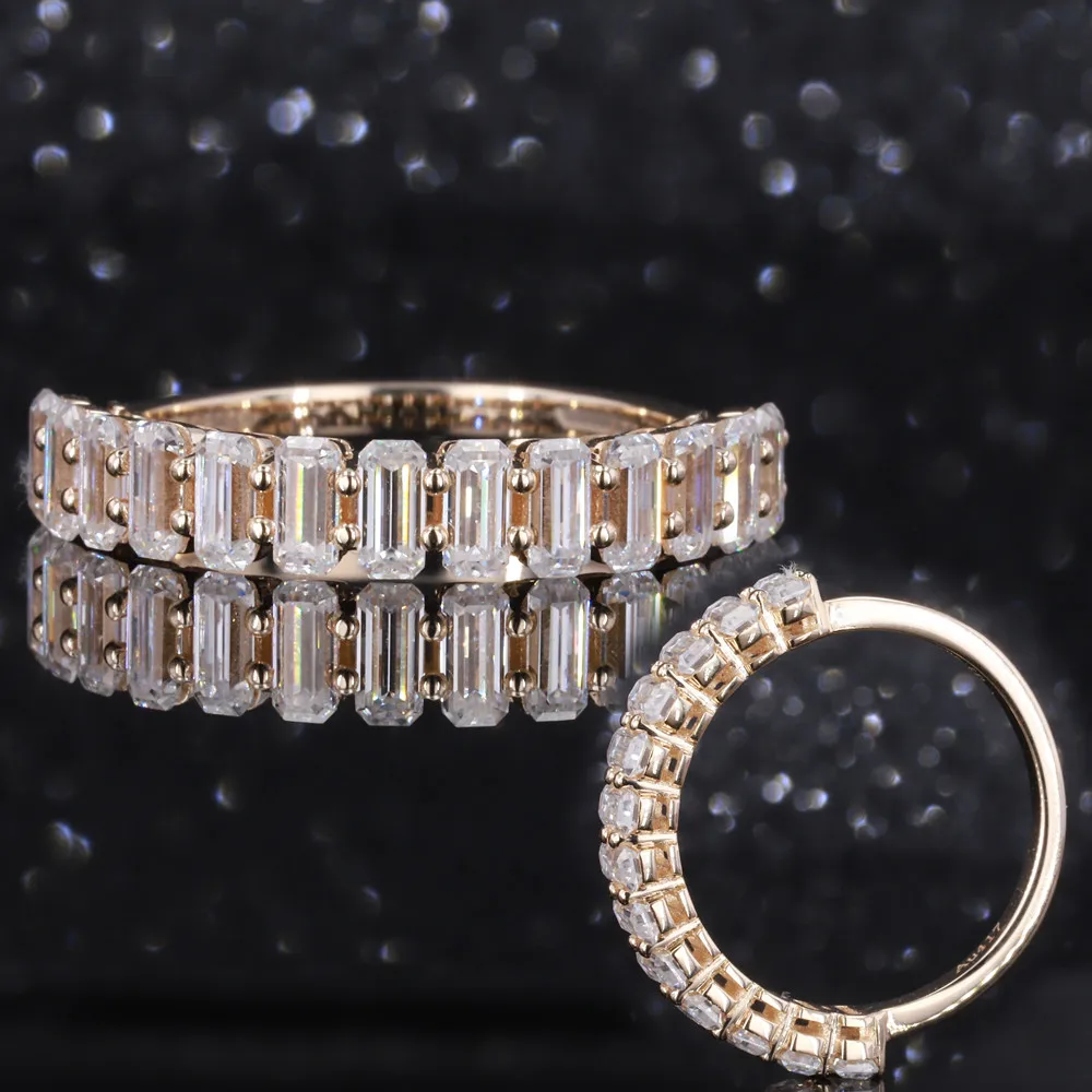 

10K yellow gold half eternity band with small emerald cut moissanite ring