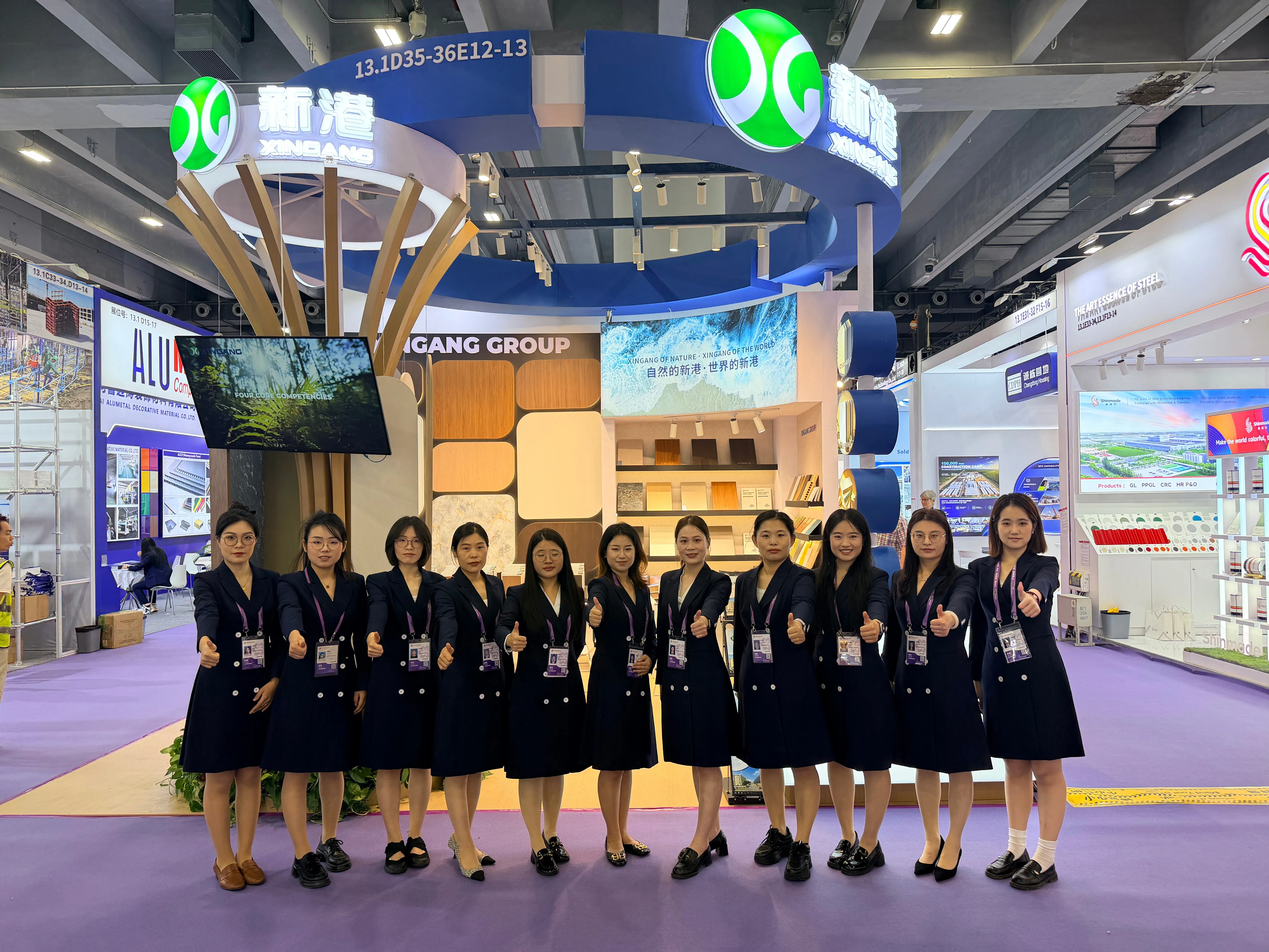 The Xingang exhibition team in front of the booth at the 140th Canton Fair