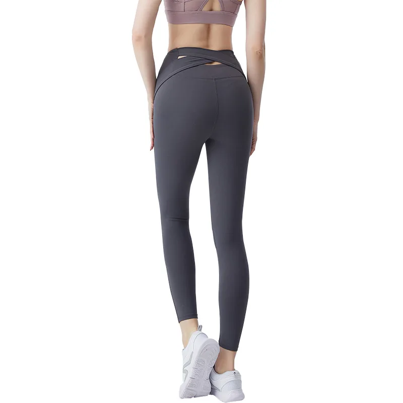 

European and American hot women's Peach Hip back cross sports pants trousers quick-drying running fitness pants high waist yoga