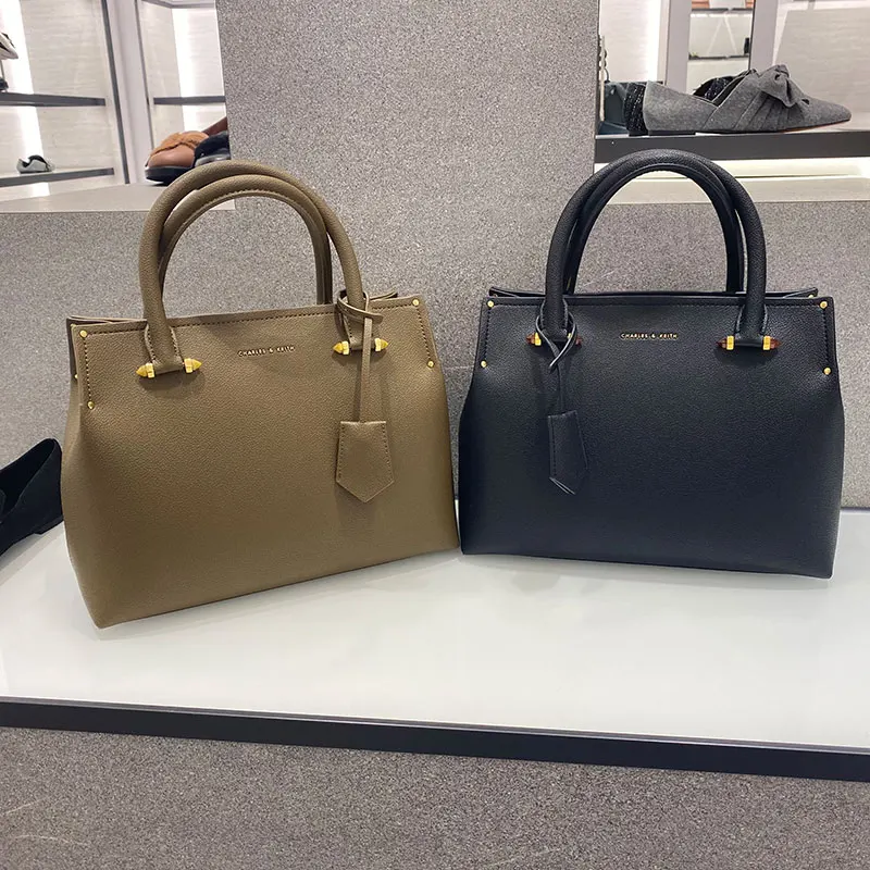 

2021 new charies k Ladies simple hanging tag decorated hand bill of lading shoulder bag Simple tag decoration commutes in solid