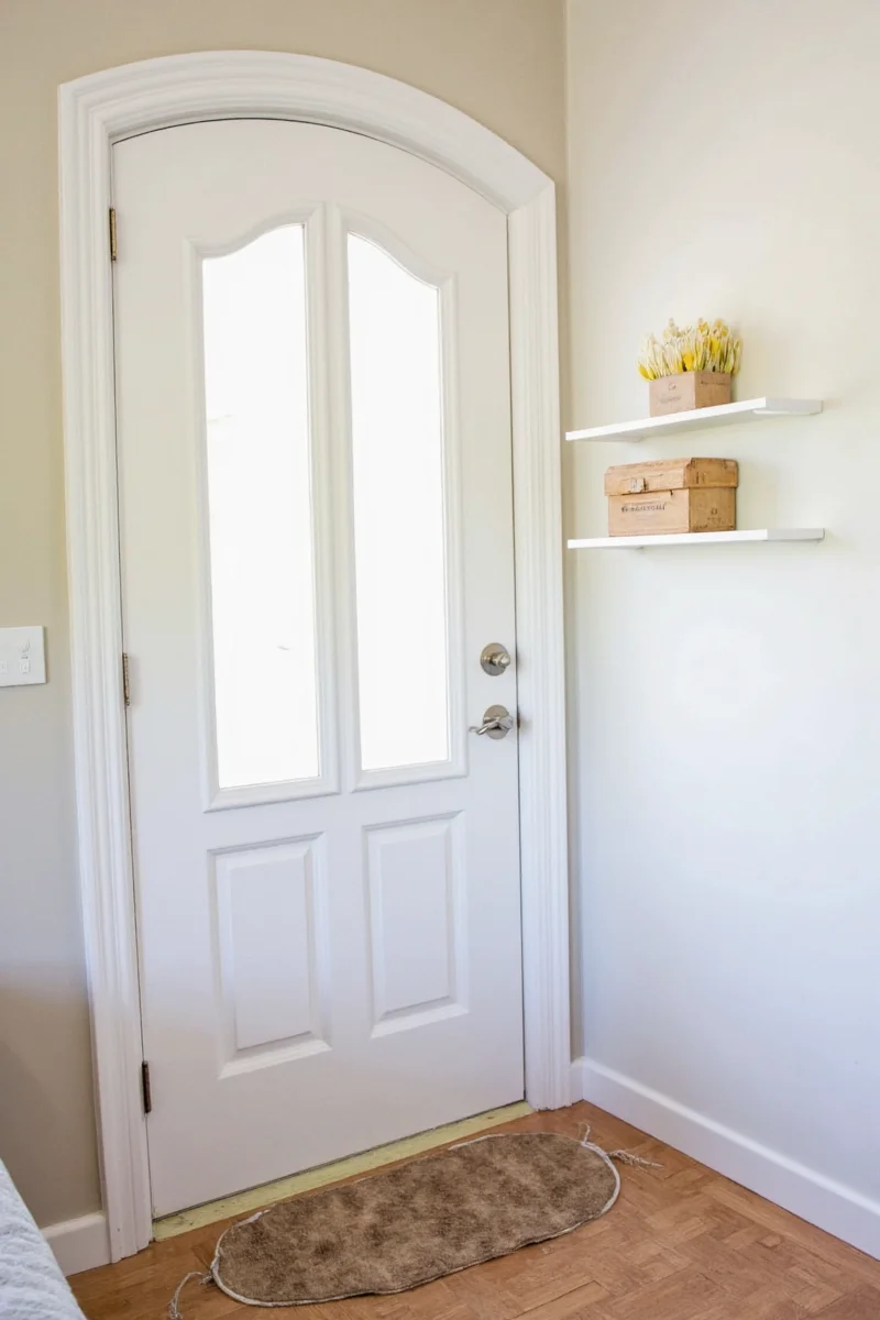 Arched doorway with floral wallpaper accent panel