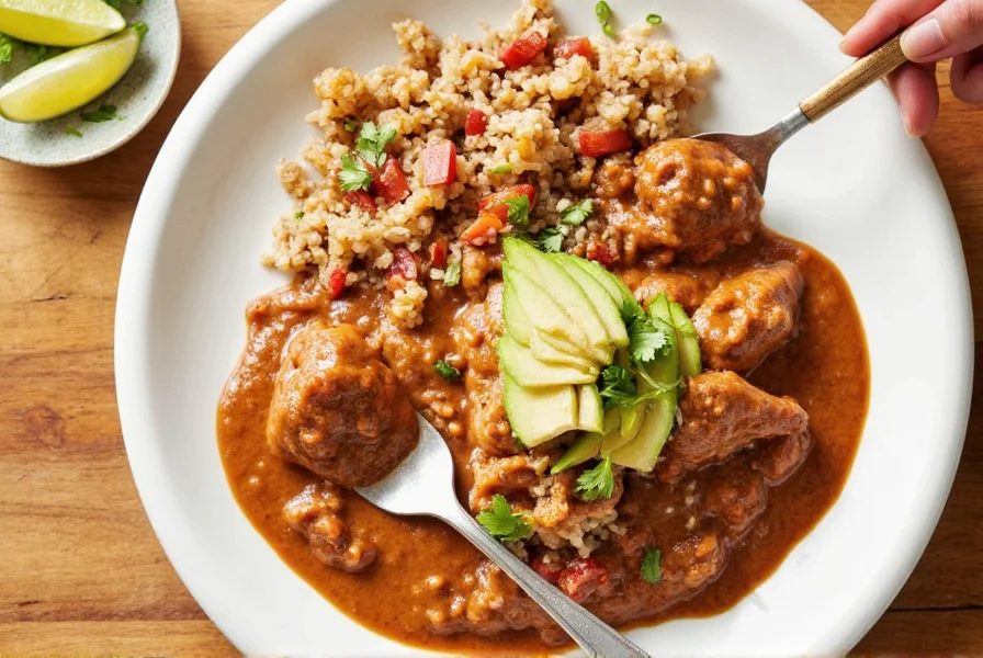 Chicken mole sauce served over rice
