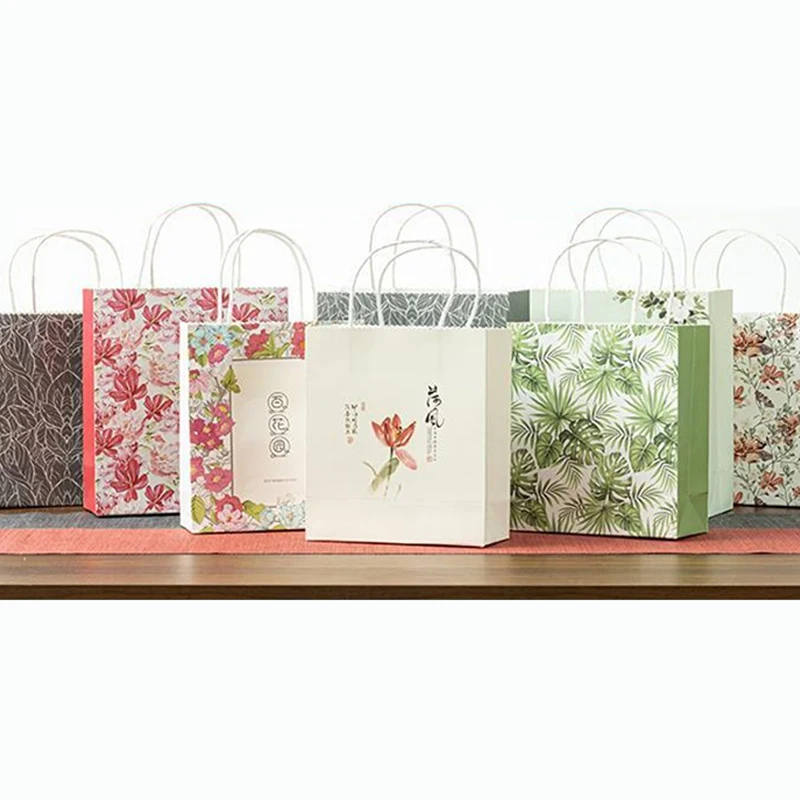 Wholesale Gift Shopping Embossing Tote Art Gift Paper Bags With Handle Custom Printed Pink Flower Cheap Paper Packaging Bags