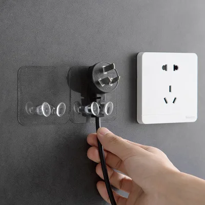 

Transparent plug wall hook Kitchen wall strong adhesive hook creative socket bracket plug rack
