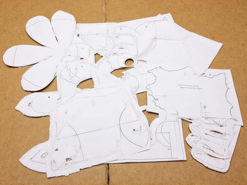 Printable paper craft templates laid out on recycled cardboard
