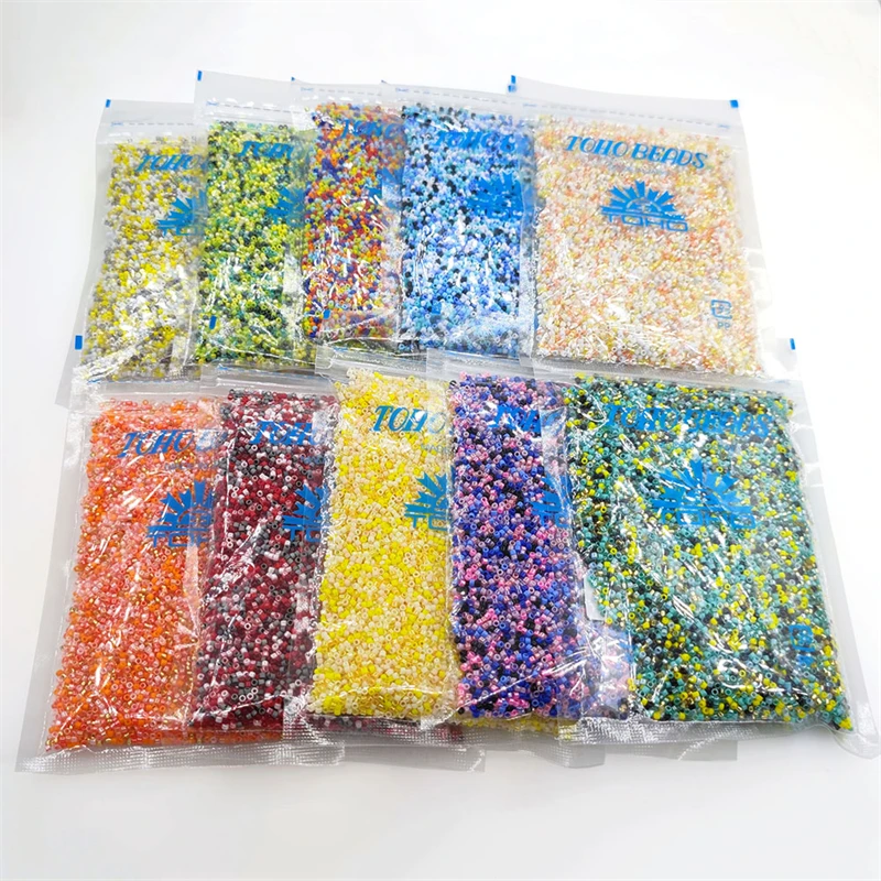 

Wholesale 100g/bag Top quality TOHO Japanese seed beads mixed colors  mini glass seed beads for Jewelry making, Please choose the pictures