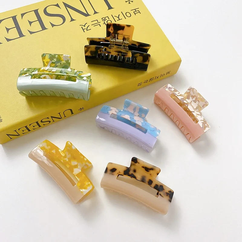 

Acetate fashion plate two-color mosaic square hollow hair claw clip