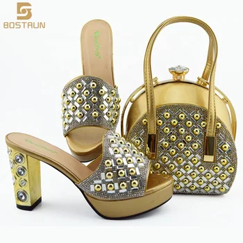 gold sandals and matching bag