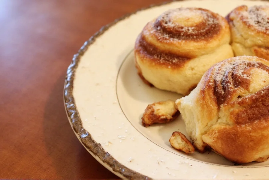 Freshly baked overnight cinnamon rolls with cream cheese icing drizzled on top