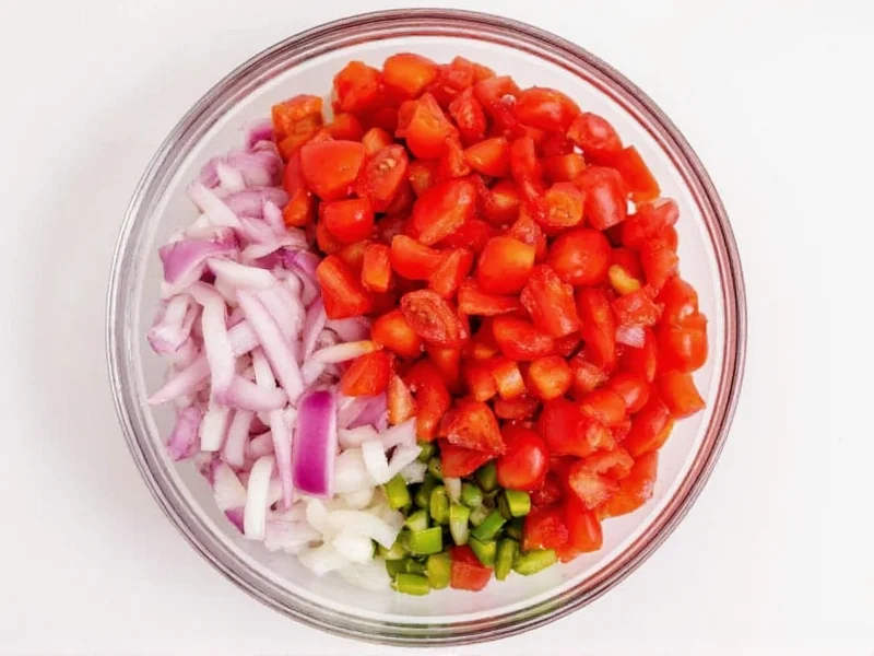 Fresh chopped tomatoes and onions in bowl for pico de gallo