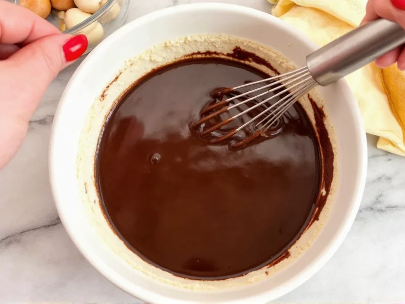 Whisking chocolate pie filling in ceramic bowl