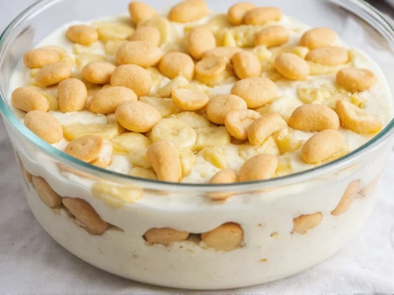 Layering banana pudding with vanilla wafers and banana slices in glass dish