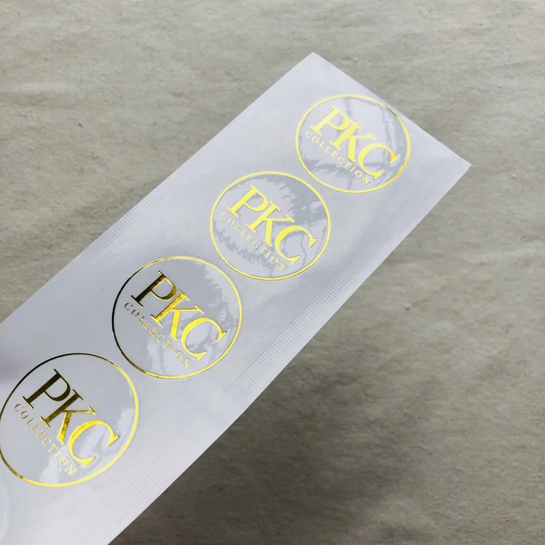 

Custom Printing logo special paper Labels Vinyl Clear Transparent Shiny Gold Foil Stamping Self Adhesive Labels Sticker, Custom color