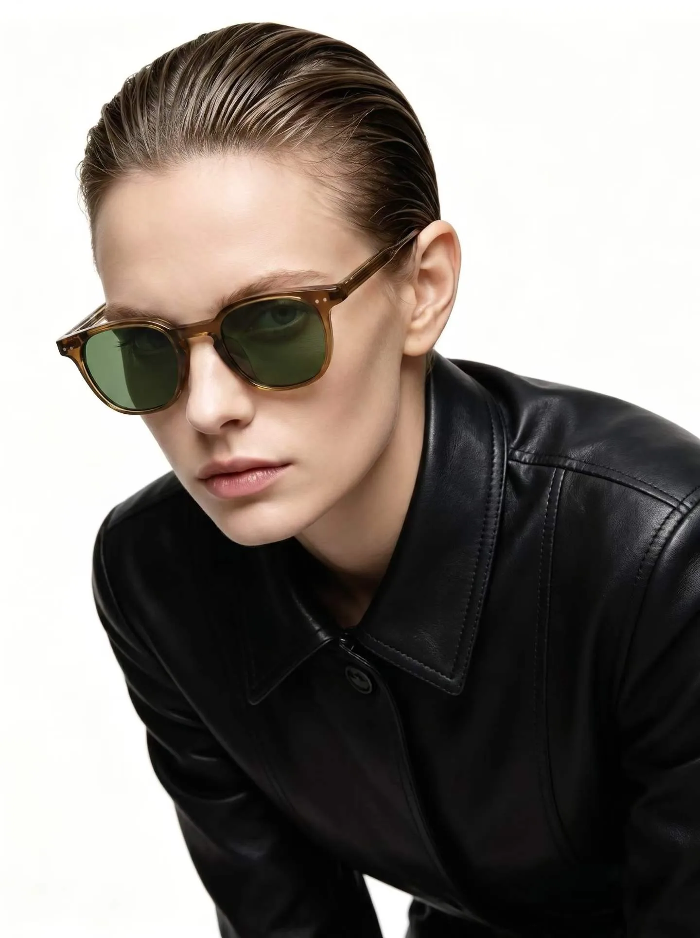 Model wearing translucent amber 6265 round sunglasses with dark green lenses