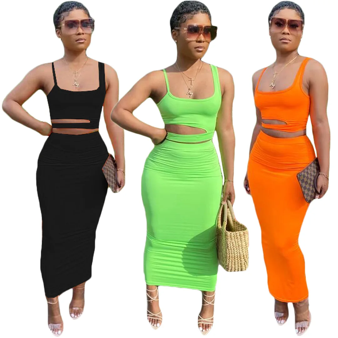 

Hot selling slim fit plus size 3XL polyester crop top 2021 solid color hollow out summer outfits two piece short skirt set