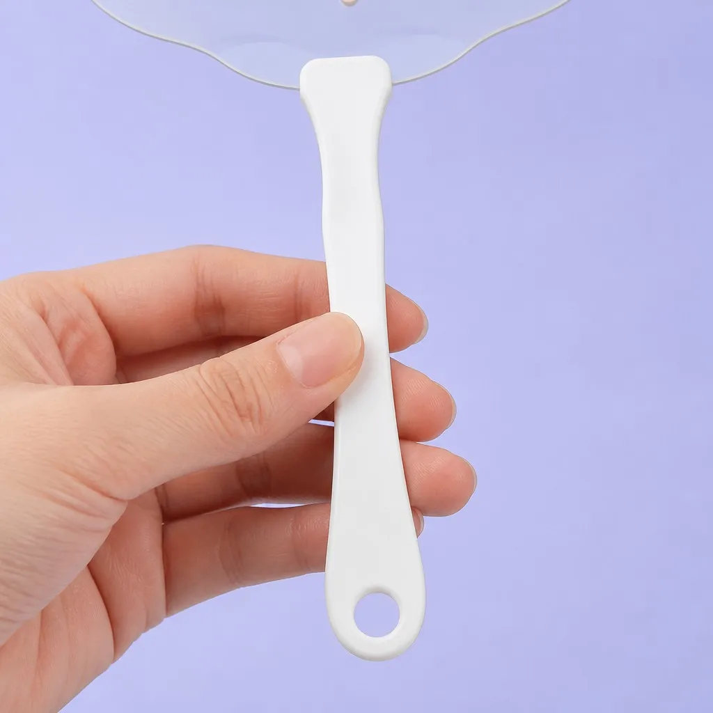 Hand holding the ergonomic white plastic handle with hanging hole