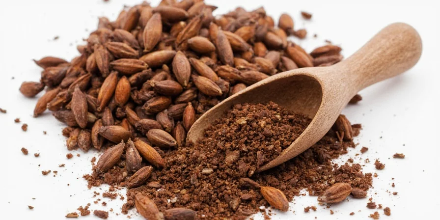 Whole and ground cloves on wooden table