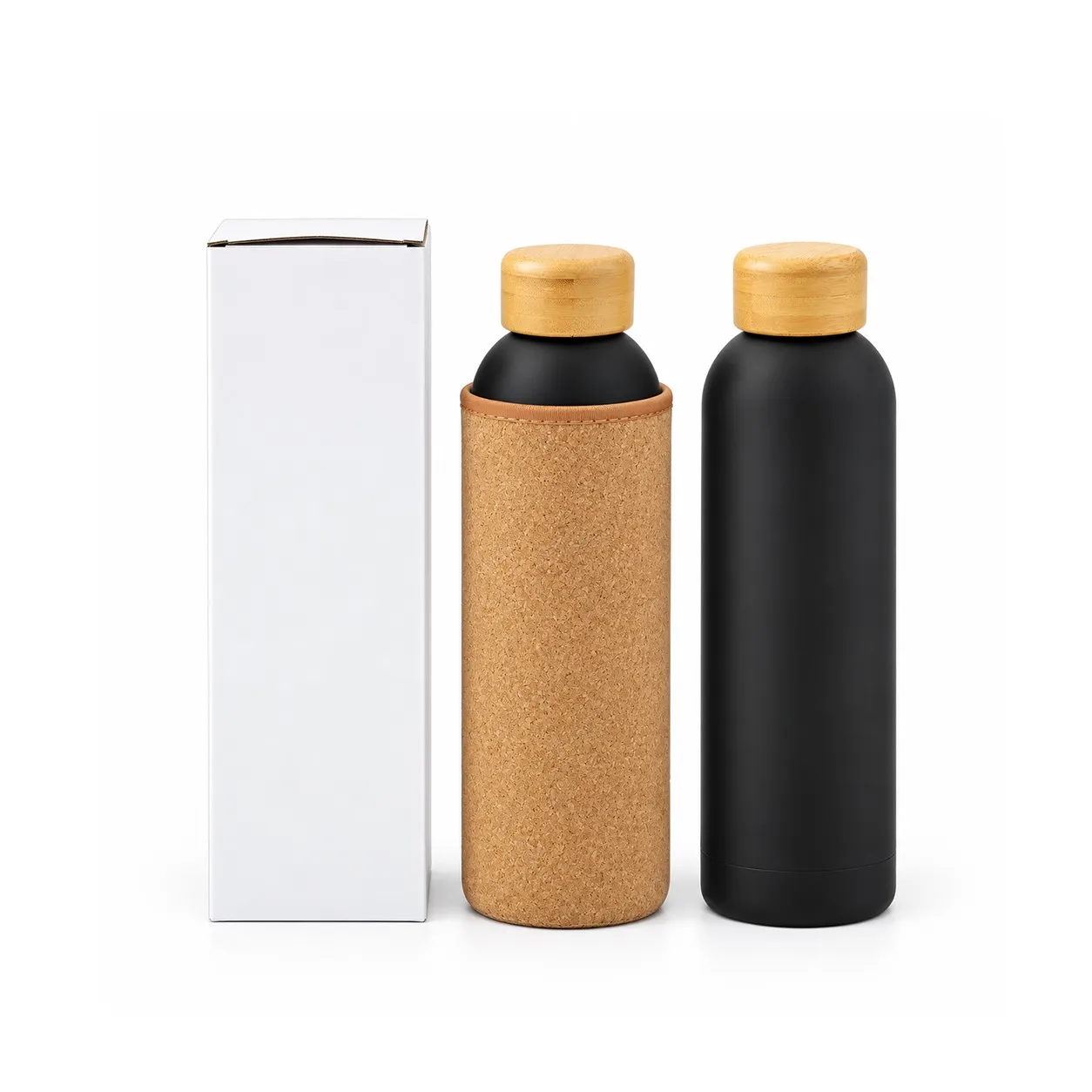 Matte black steel bottle in a cork sleeve and a plain black bottle standing beside a white gift box