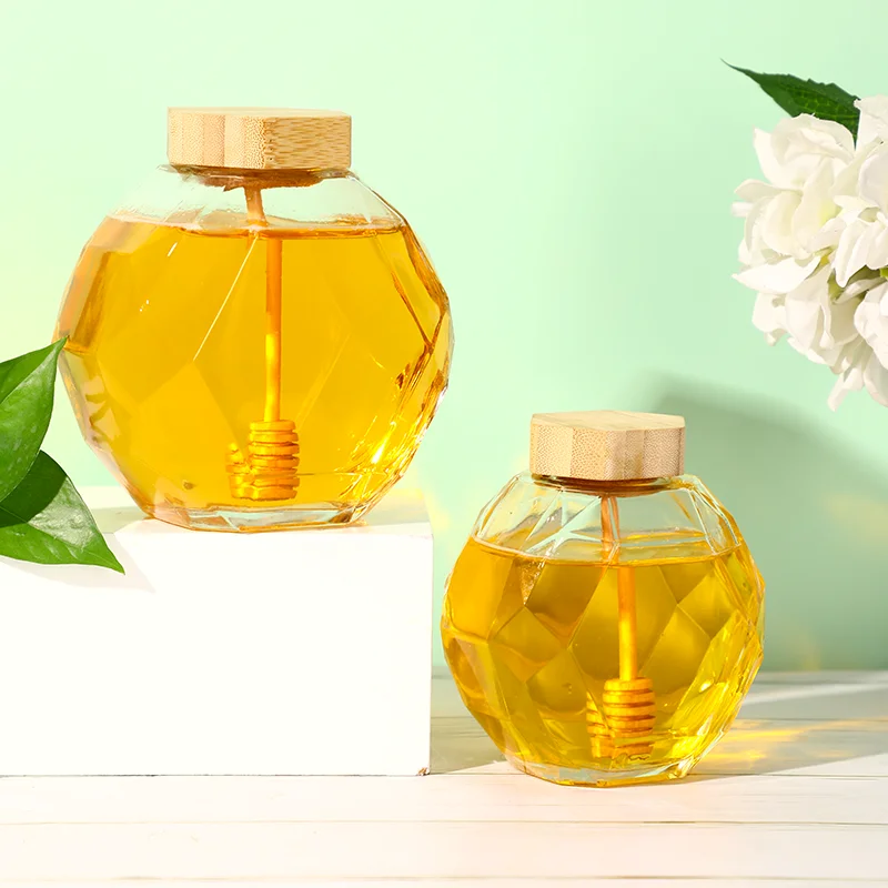 

Unique hexagonal transparent glass honey jar with natural wooden cover and wooden mixing rod