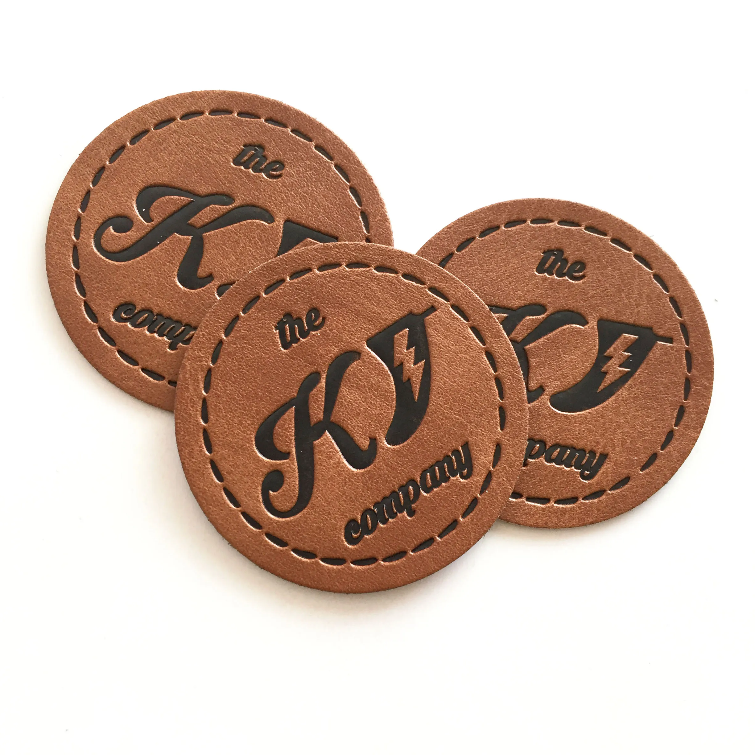 

Cheaper Jeans PU Leather Labels With Embossed Logo Round Leather Patch For Clothing Hats