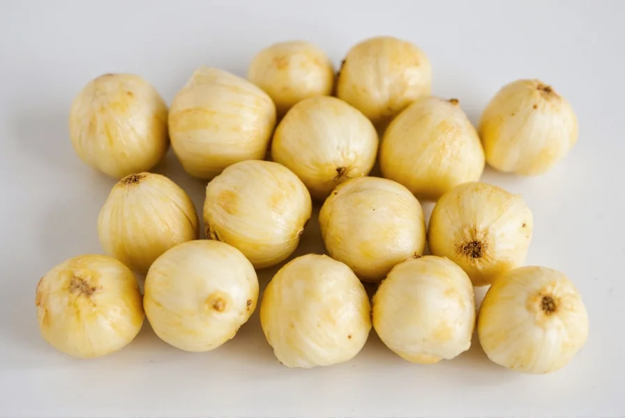 Unpeeled garlic cloves tossed in olive oil ready for oven roasting