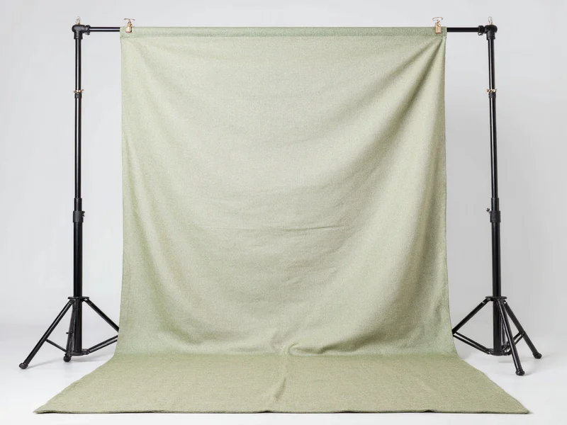 Recycled fabric backdrop hanging on DIY photography stand
