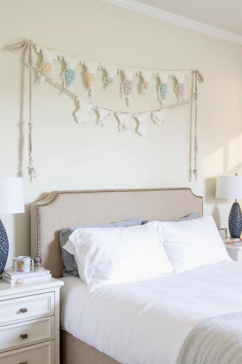 Clothesline photo display above bed with clips