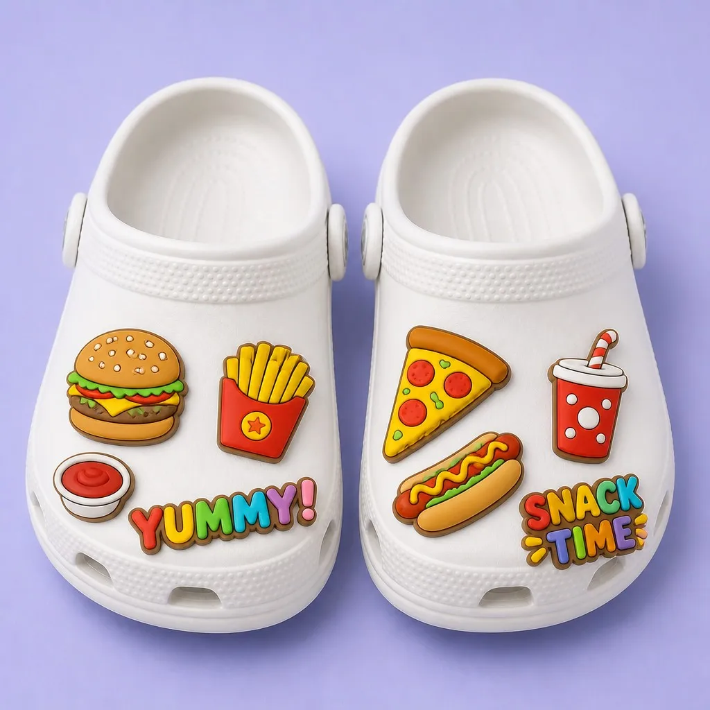 Matched pair of white clogs styled with cheeseburger, fries, pizza, hot dog, soda and slogan charms