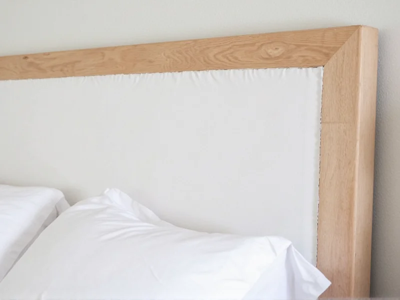 DIY headboard cover project showing fabric stretched over wooden frame