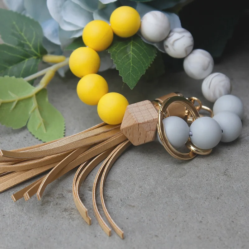 

New Design Yellow Beads Bracelet Silicon Beads Key Ring With PU Tassel Key Chain, Customized color