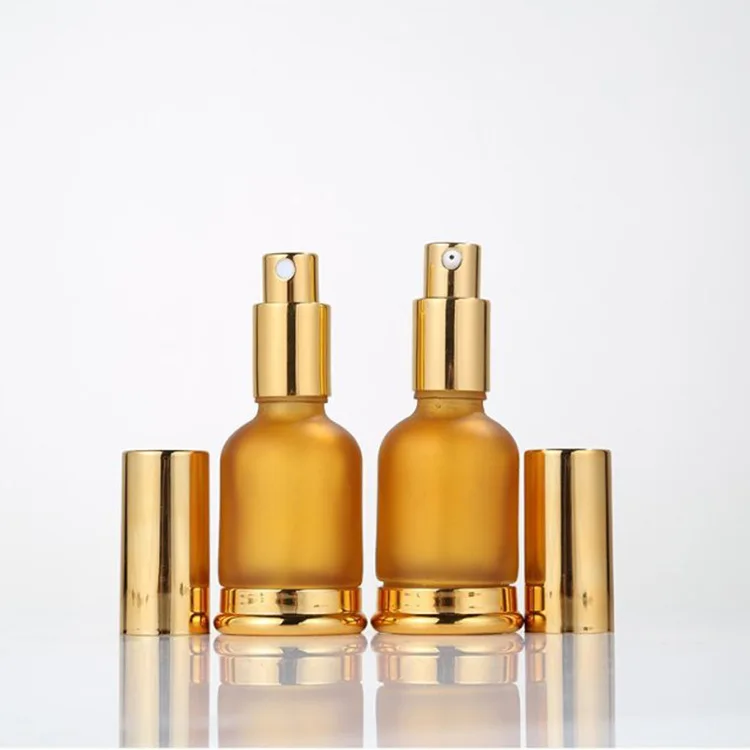 

New design gold essential oil pump bottle cosmetic spray glass bottle 30 ml